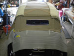 Top installation in progress showing headliner, reinforcing straps, and pads