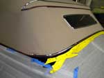 Completed top installation showing rear chrome moldings, weather flap, and rear window
