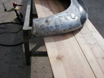 Right rear fender after stripping paint revealing many flaws